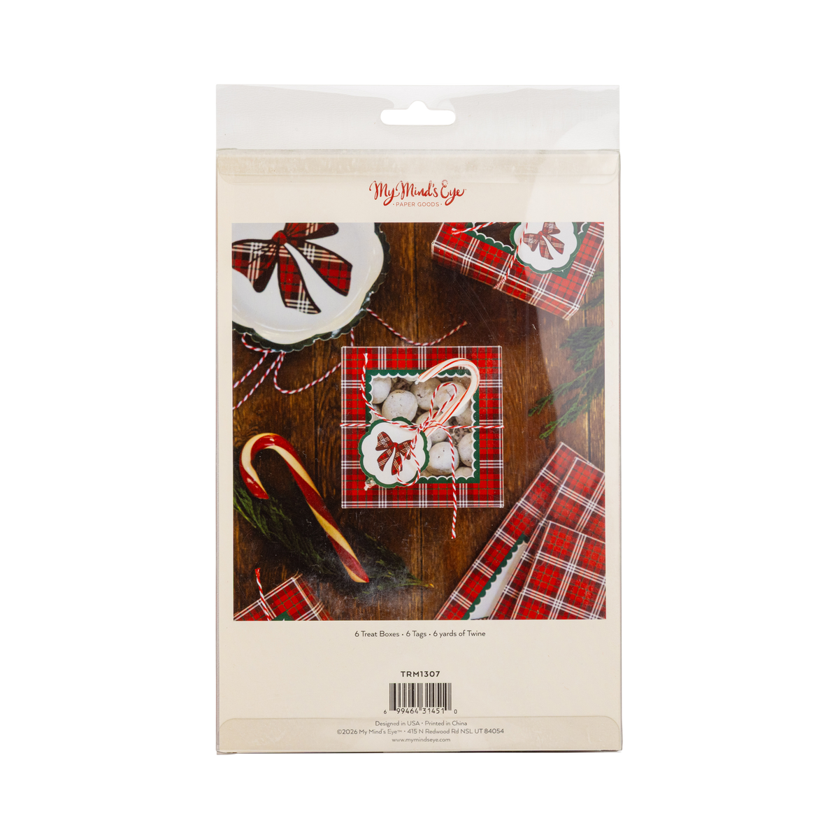 Back of plaid Christmas cookie box package showing contents list: 6 boxes, 6 tags, 6 yd twine