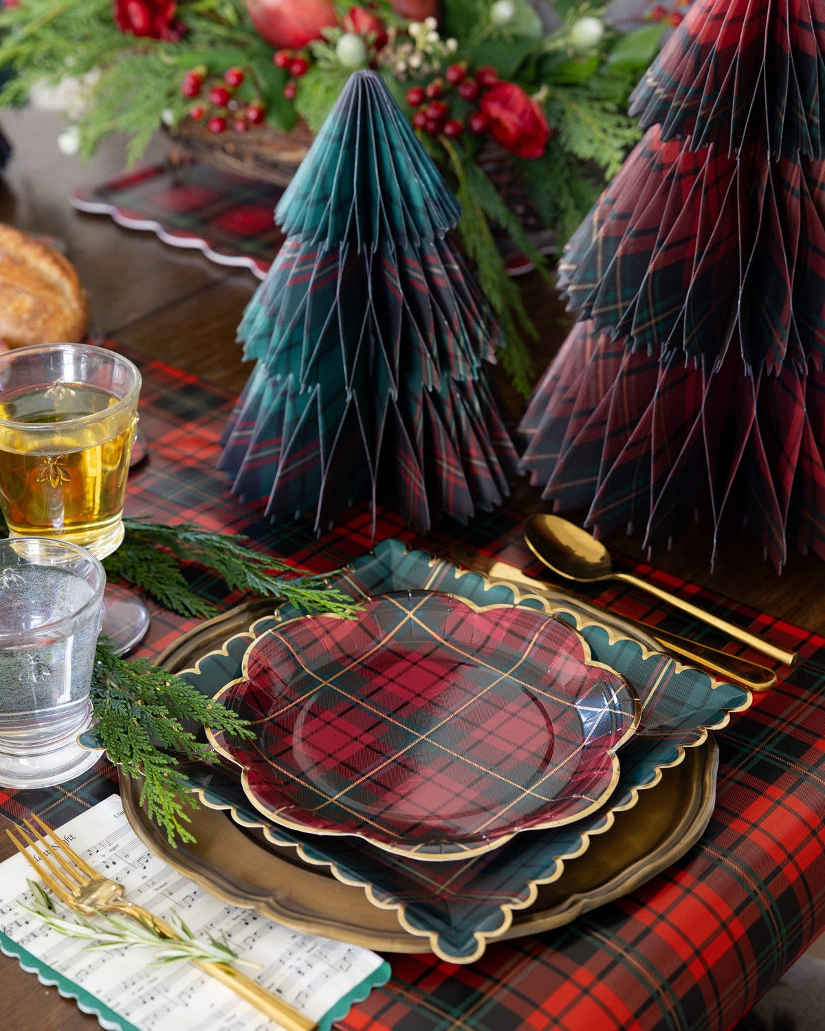 Plaid honeycomb Christmas trees styled on a holiday table with plaid plates