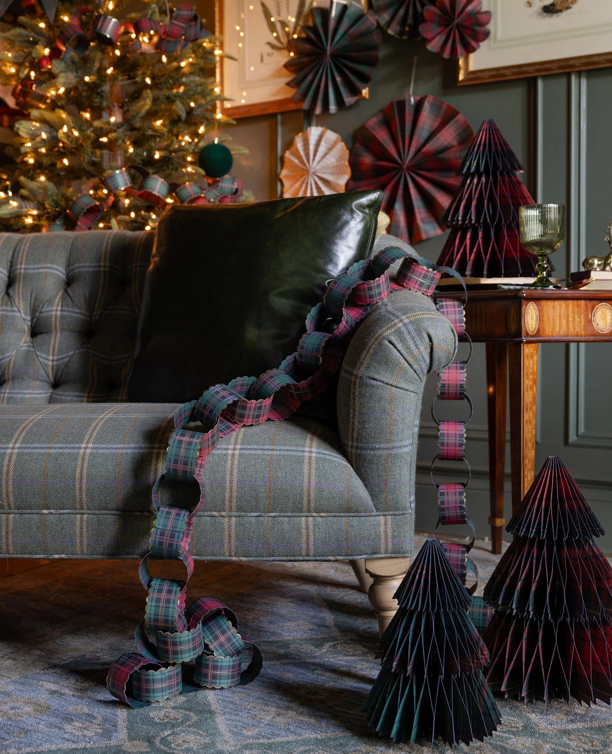 Plaid honeycomb Christmas trees styled in a living room with plaid accents