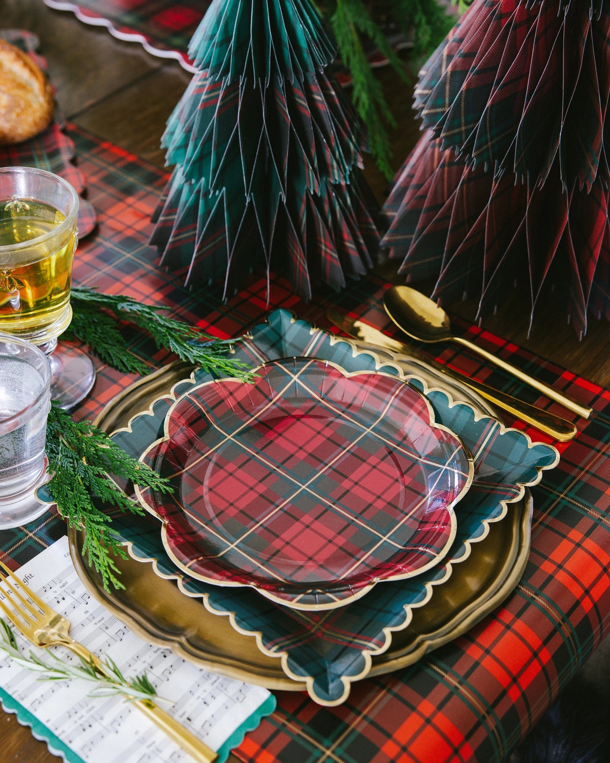 Plaid paper table runner styled on a holiday table with plaid plates