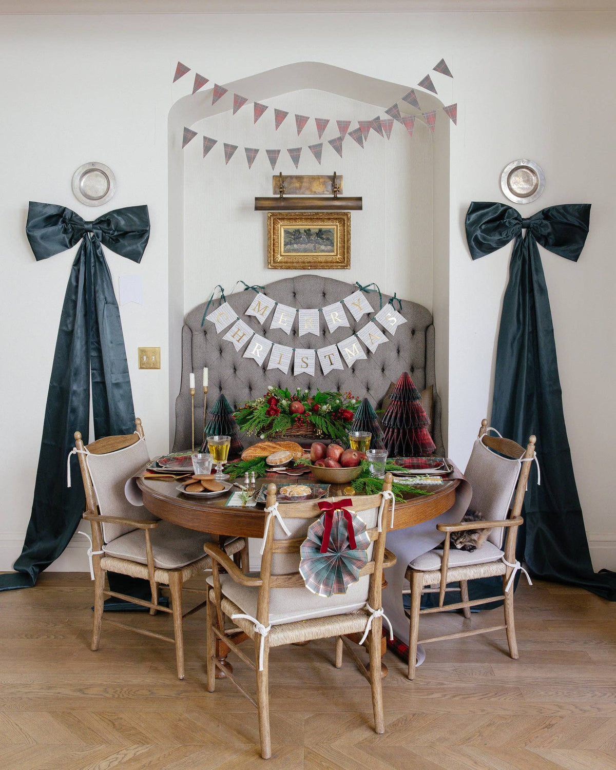 Plaid pennant banner styled above a holiday party table
