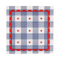 Single plaid stars paper cocktail napkin flat lay showing navy plaid pattern with red stars and scalloped border