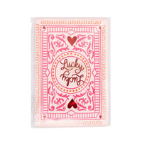 Close-up of lucky card napkin showing heart and card details