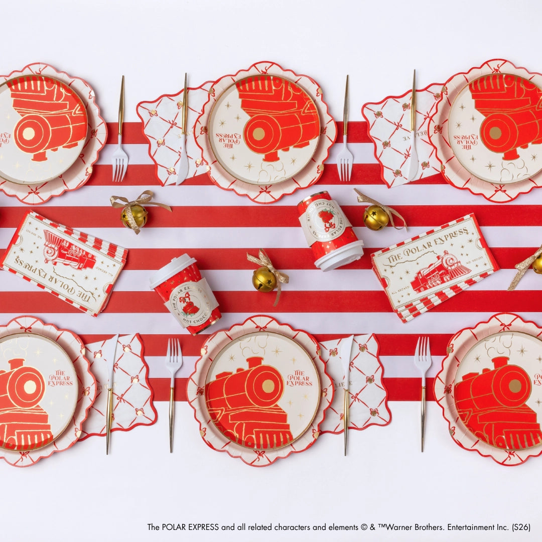 Polar Express ticket guest towels styled on a Christmas table flat-lay