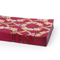 Pomegranate red Rococo guest towels shown folded and stacked at an angle