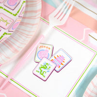 A Mahjong Cocktail Napkin styled with a pink fork as part of a Grandmillennial Table Decor setup.