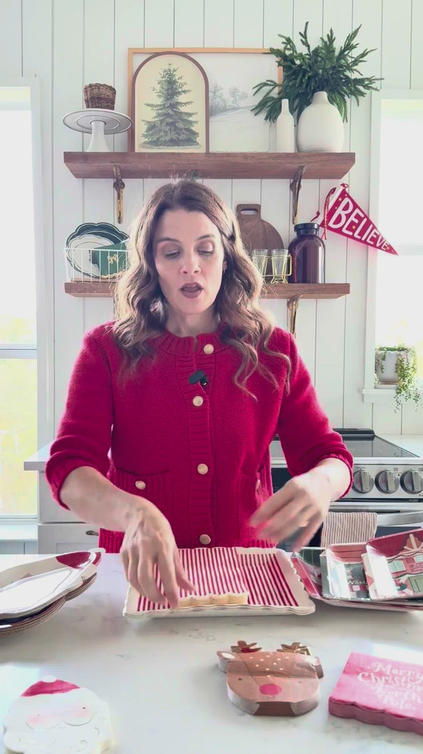 Video showing Rudolph shaped dinner napkins displayed for holiday table styling