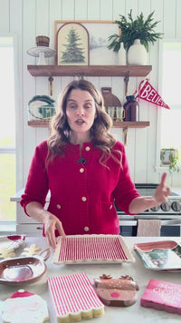 Video showing Santa shaped paper plates with coordinating tableware