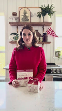 Video demonstrating the size of the Christmas cottage treat boxes and showing how they look layered on a dinner plate at a table place setting.