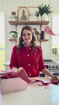 Video of woman showing Red Bow Christmas Paper Banner