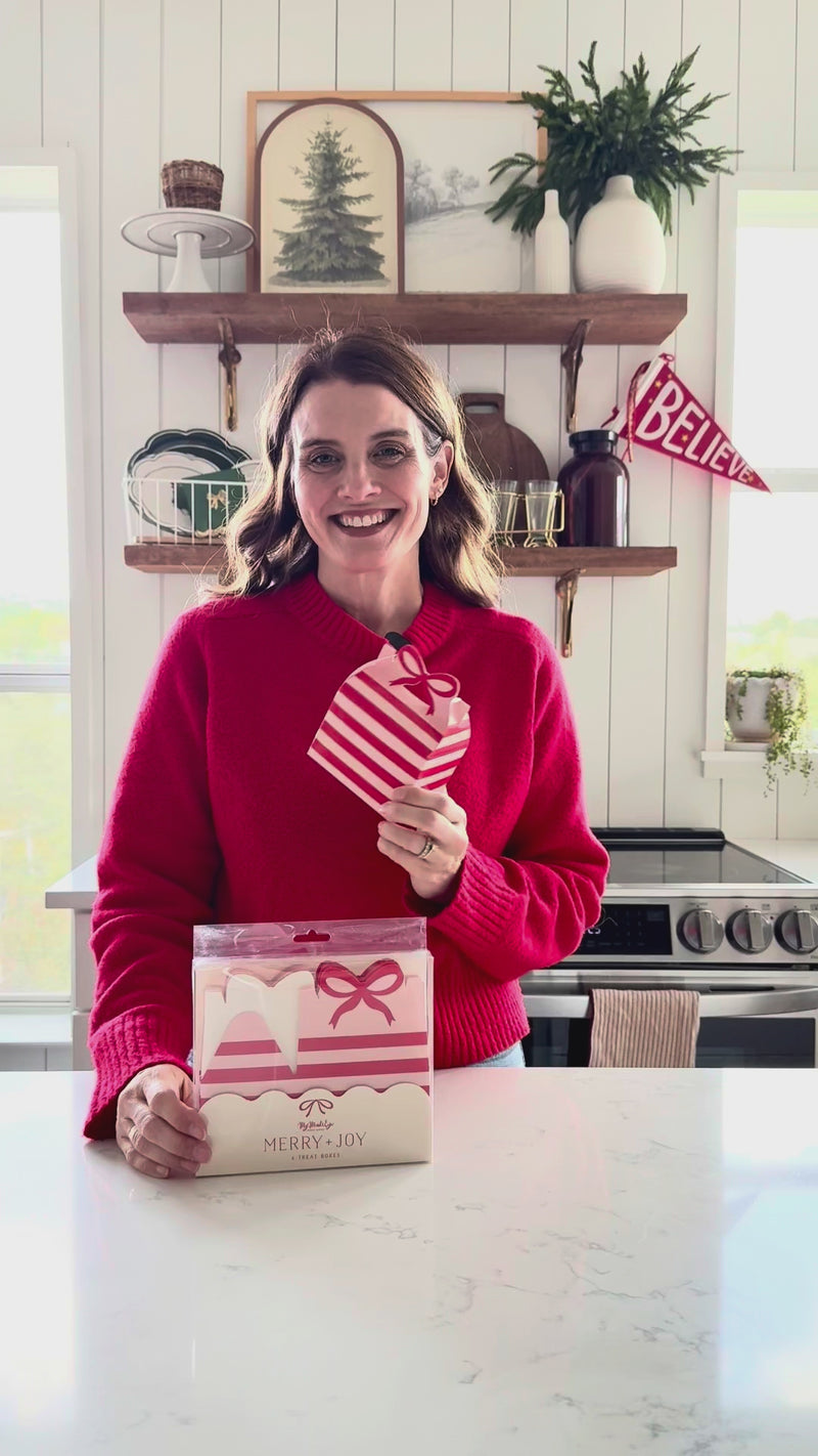 Video demonstrating the simple assembly of the red and pink Christmas cookie box and showing the finished bow handle.