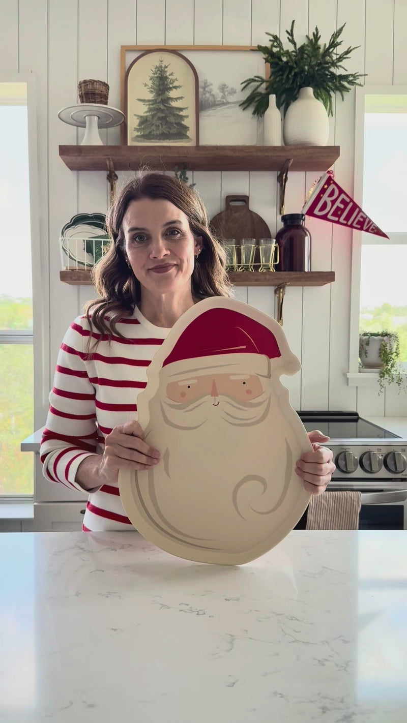 Video review demonstrating the size and durable material of the Santa tray, noting it is a dishwasher-safe bamboo platter.