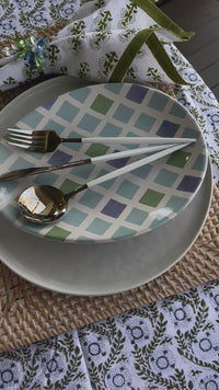 Easter plates shaped like oval eggs with different blue and green designs - perfect for Spring Table