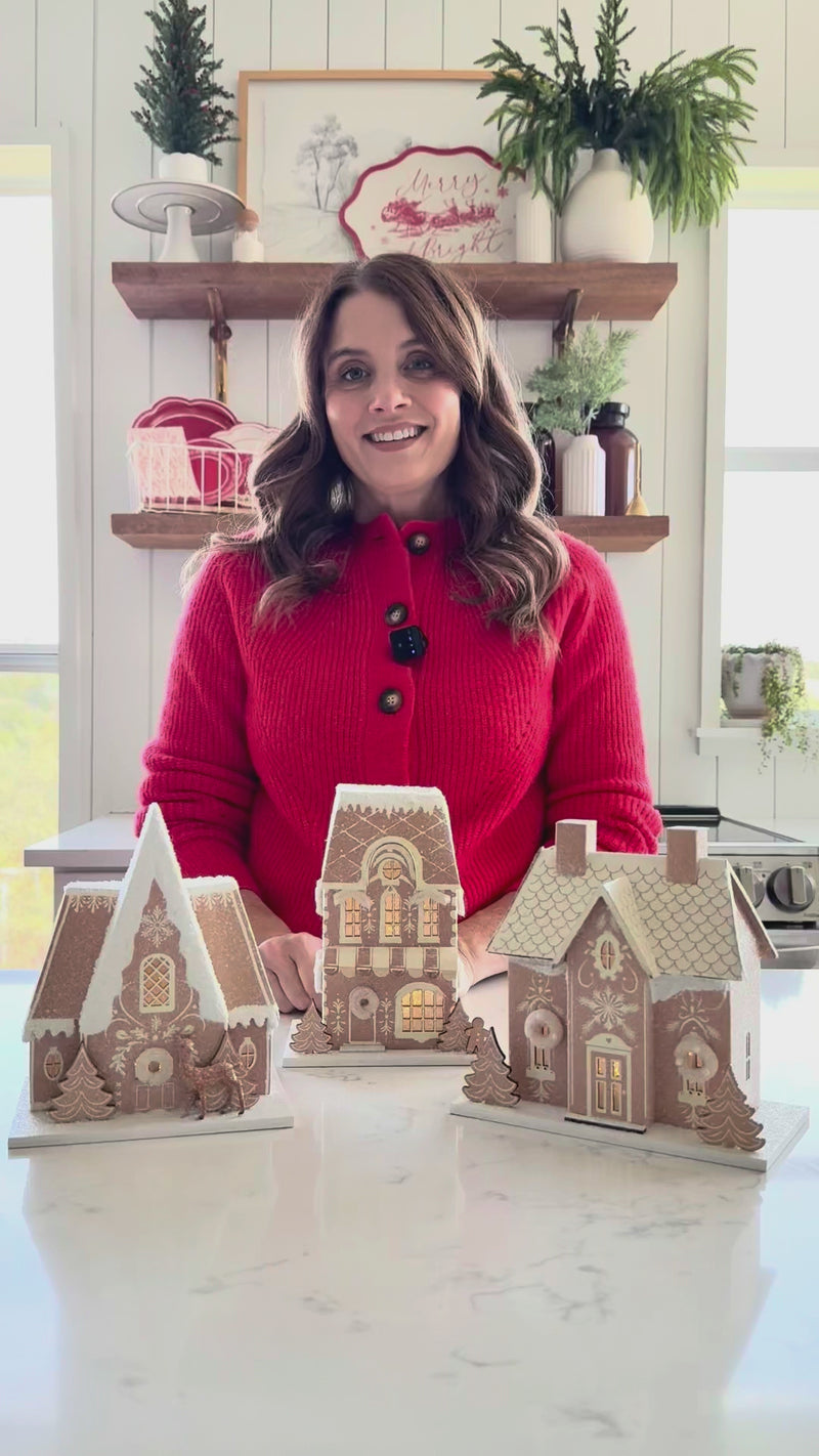 Video demonstration showing the size and A-frame Christmas house shape of the Gingerbread Chalet decor and comparing it to other Christmas village pieces.