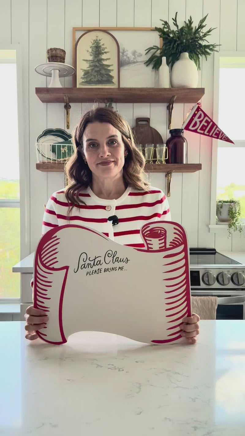 Video review demonstrating the size and features of the Christmas paper placemats, showing the Santa scroll design and the space for writing wishes.