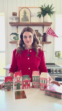 Video demonstrating the five designs of the North Pole Village advent calendar boxes and showing the included gold foil sticker sheet.