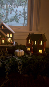 Vintage Halloween Putz house village featuring Cauldron Café, Owen Sisters Witch Boutique, and Red Victorian light-up houses.