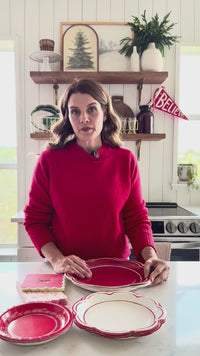 Video demonstrating the layering of the cream and red scalloped edge plates, showcasing the quality and size of this disposable dinnerware option.