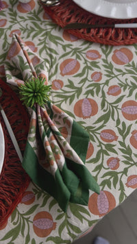 floral cloth napkin in green and orange pomegranate design - perfect for a spring table or an Easter tablescape. These are lovely spring Napkins.