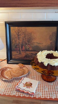 Thanksgiving dessert being served on fall leaf turkey paper plates with gold scalloped edges and matching turkey napkins
