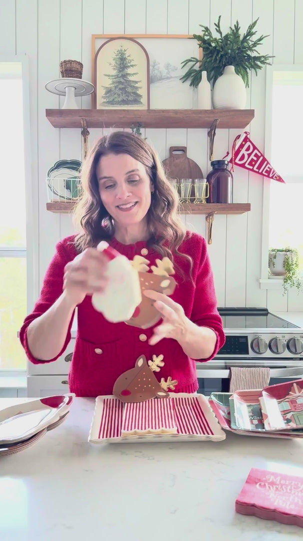 Video showing Santa shaped dinner napkins styled for Christmas table settings