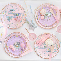 Princess dessert plates holding cupcakes on fairytale party table.
