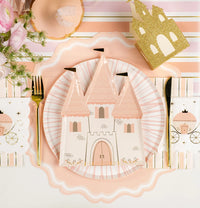 Hero setting with glitter castle centerpiece and striped charger under plate.