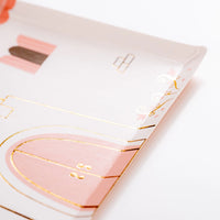 Close detail of gold-foil trim and castle door on princess house plates.