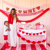 Valentine party setup featuring puffy heart felt banner