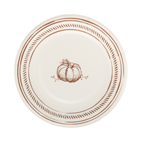 Round paper plate with brown pumpkin design and decorative edge.
