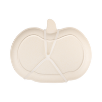 Close-up of the pumpkin-shaped bamboo plate showing the natural bamboo texture, bottom view.