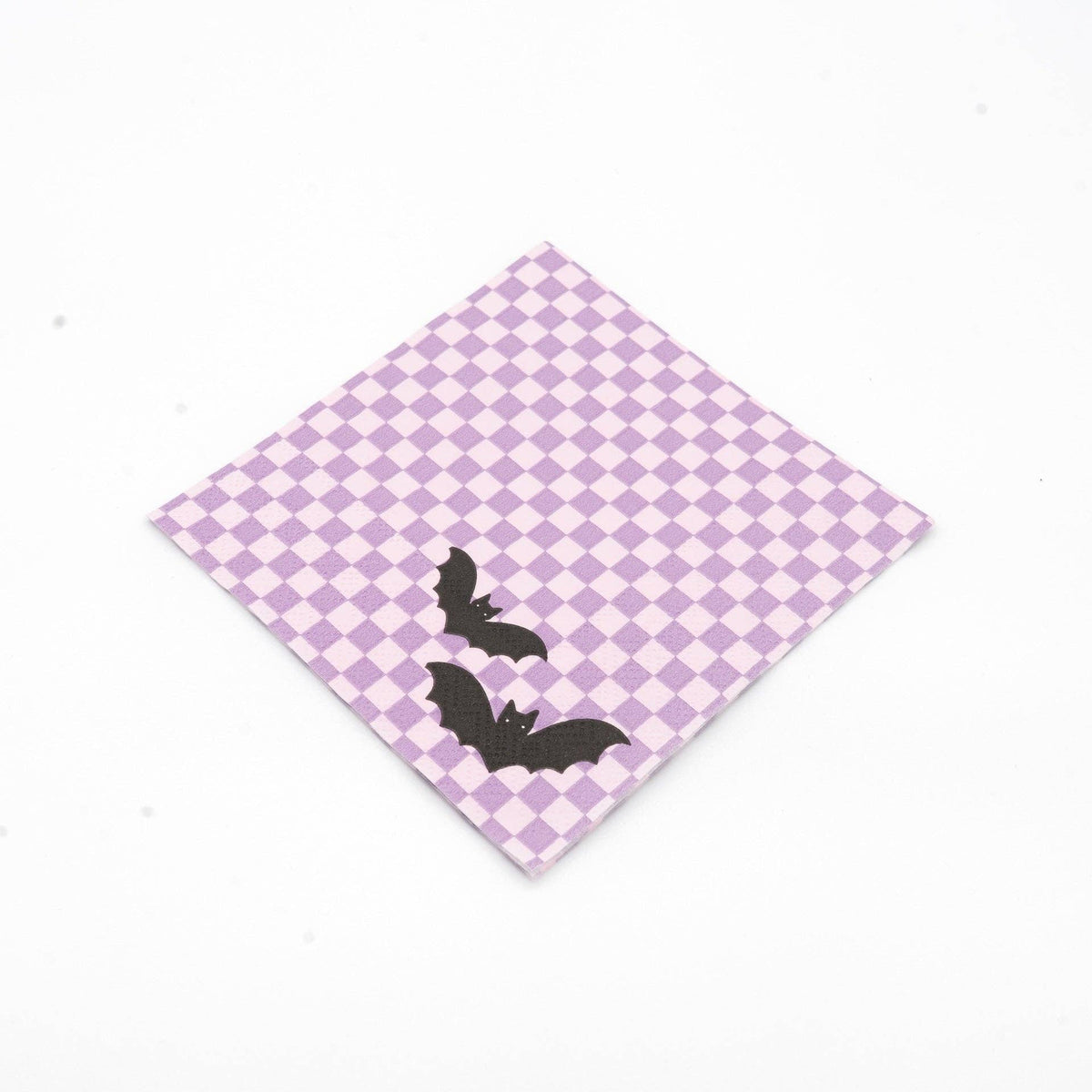Single purple checkered bat paper cocktail napkin angled on a white background