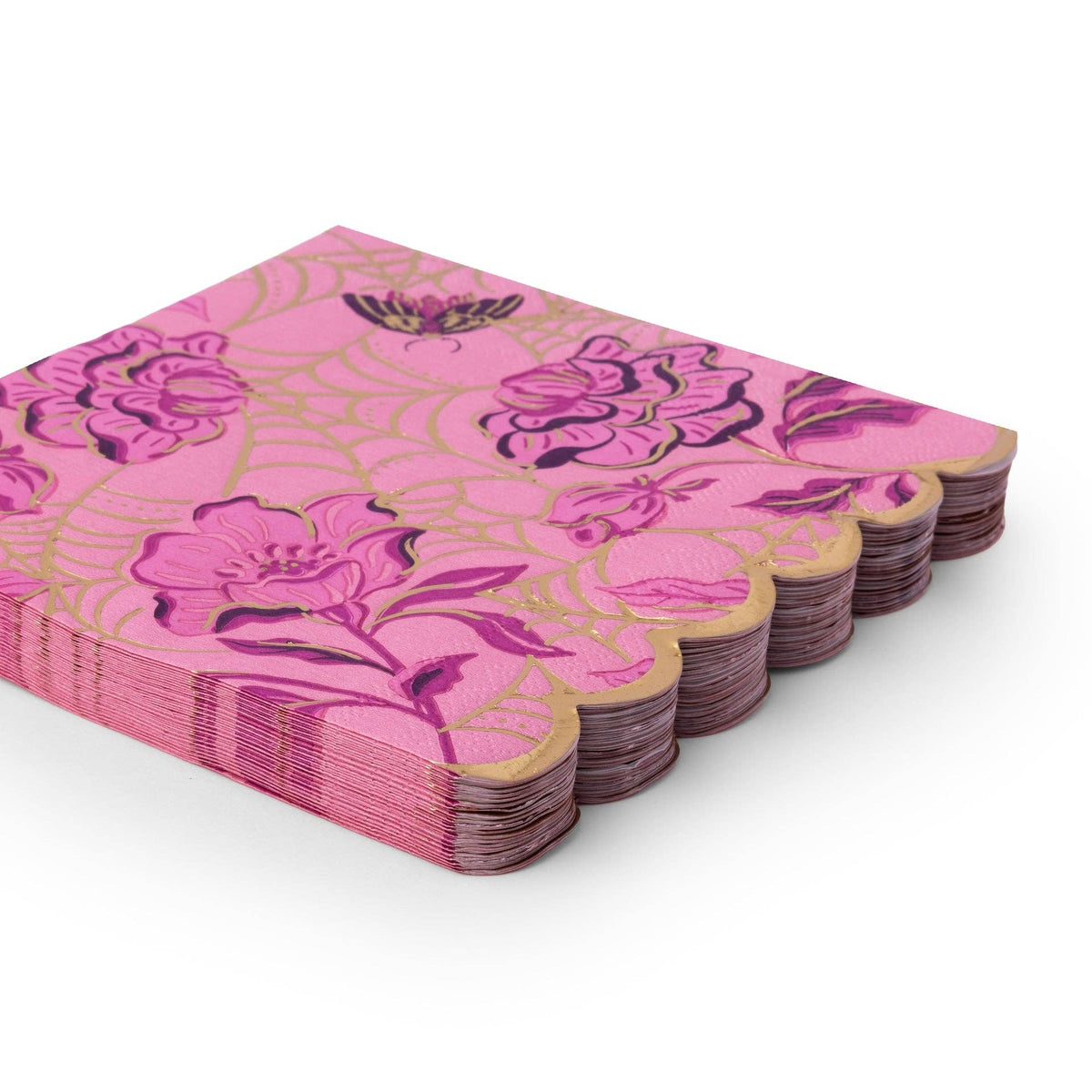 Stack of folded purple gothic-glam Halloween napkins showing the gold-foil floral print and gold scalloped edge from an angle.