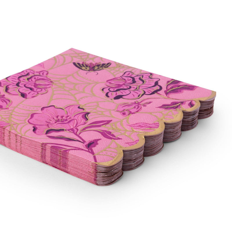 Stack of folded purple gothic-glam Halloween napkins showing the gold-foil floral print and gold scalloped edge from an angle.