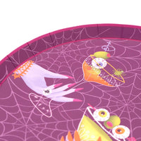 Close up angled view highlighting the raised rim and glossy printed finish of the purple Halloween paper plate.