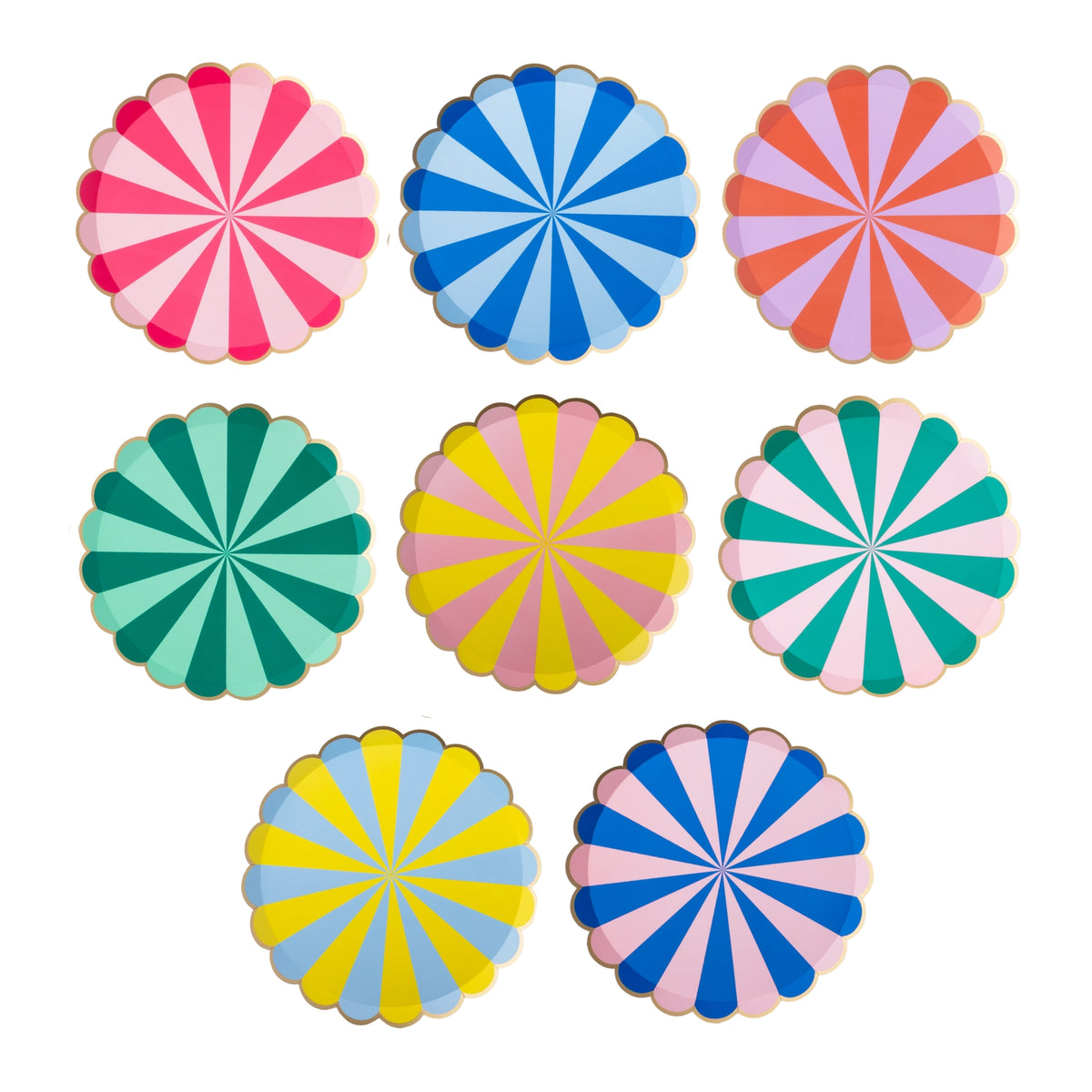Eight rainbow stripe scalloped paper party plates in different colors arranged together