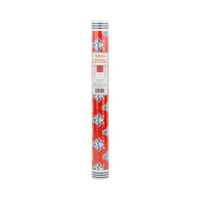 Red block print floral paper table runner in rolled packaging with Hamptons label
