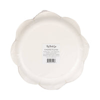 Back of red and blue bow scalloped paper plates showing white plate underside with product label and barcode