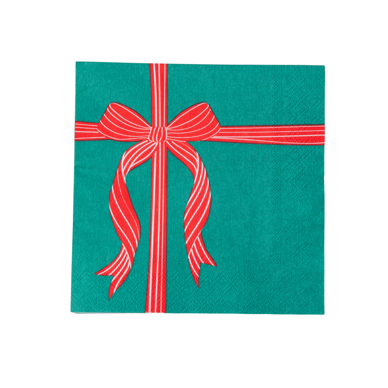 Green lunch napkin printed with a striped red bow and ribbon crossing like a wrapped gift