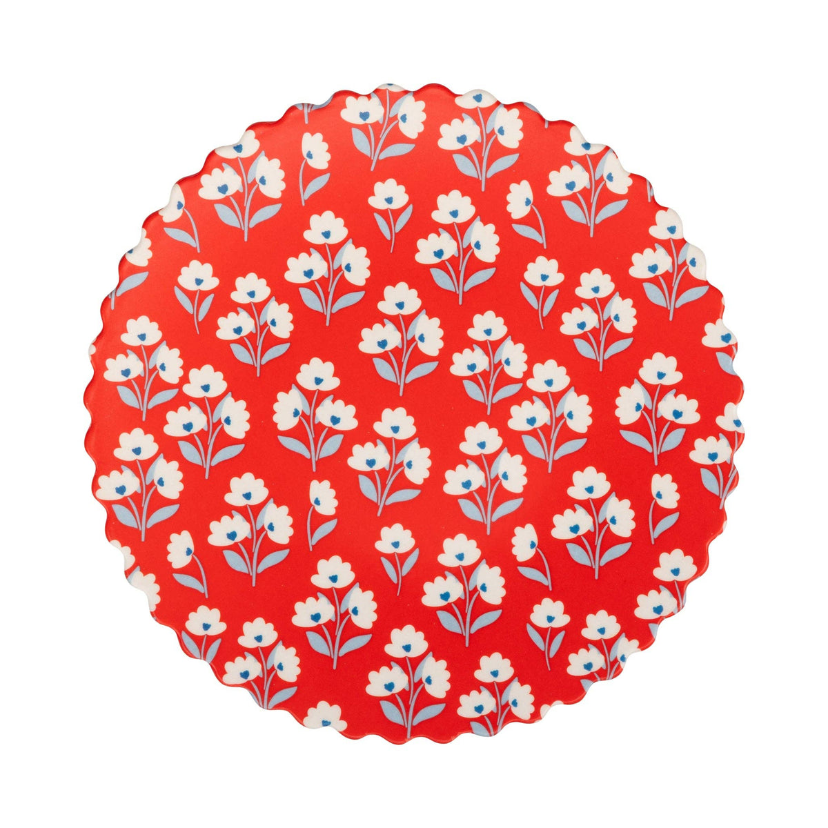 Flat lay of red floral bamboo plate with white folk flowers and blue centers on white background