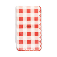Front view of red scallop gingham dinner napkins packaging