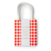 Set of 8 red gingham paper favor bags stacked with a gold foil band reading 8 favor bags