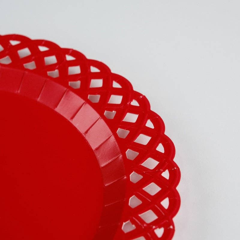 red paper plate with lattice edge detail close-up showing embossed texture.