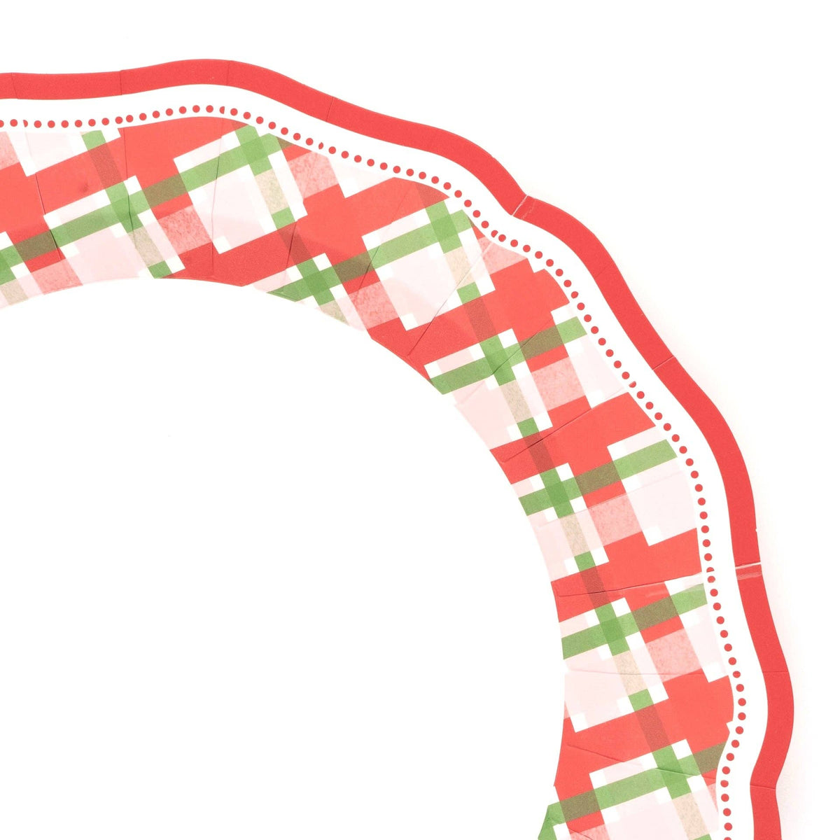 Angled close-up of the plaid dinner plate showing the red scalloped rim and tartan pattern.
