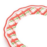 Close-up of the plaid dinner plate's scalloped red edge and plaid border.