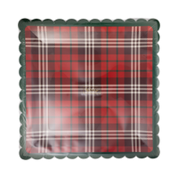 Stack of red plaid square paper plates with green scalloped edge in clear packaging