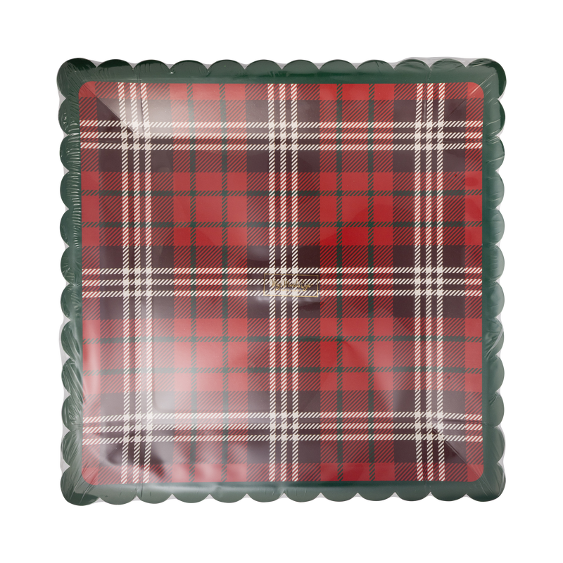 Stack of red plaid square paper plates with green scalloped edge in clear packaging