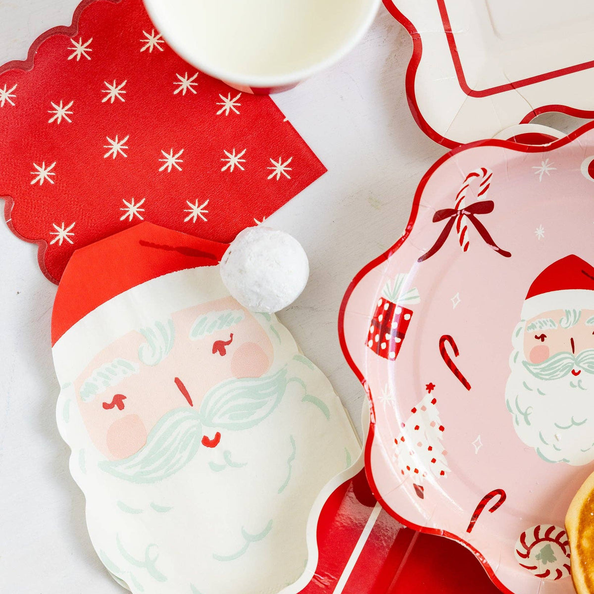 Star napkin styled with Santa plates and cups on a holiday table