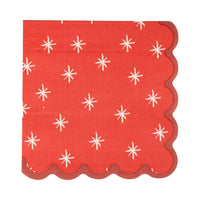 Red cocktail napkin with white star pattern and scalloped edge
