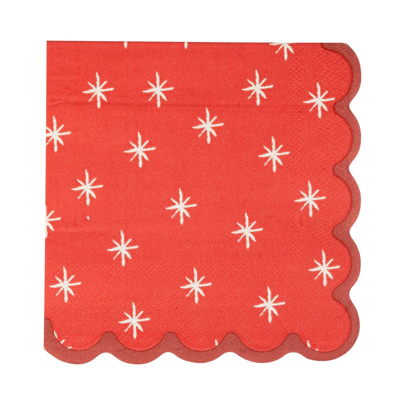 Red cocktail napkin with white star pattern and scalloped edge